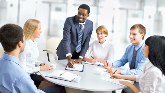 African American man leading business meeting