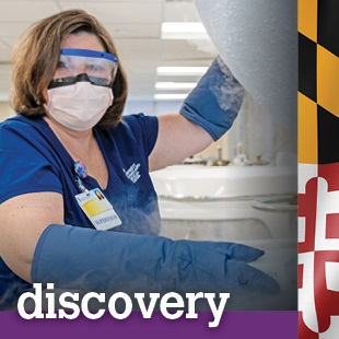 woman wearing medical gear, gloves and goggles with word discovery at the bottom