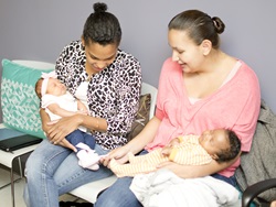Community building two mothers with newborns