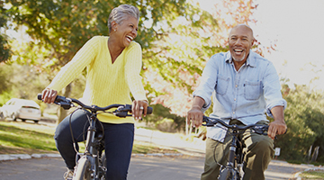 Two people riding bicycles