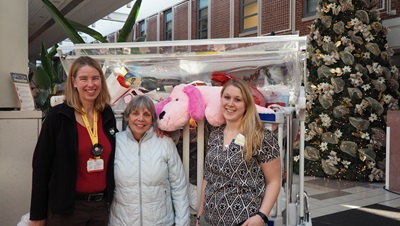 Vicki Slater, center, with Shannon Joslin and Kayleigh McQuaid of Child Life. The Slaters make an annual holiday toy donation each winter.