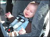 Photo of a baby in a rear-facing car seat