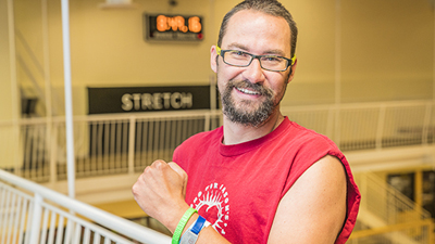 Heart transplant patient Jason Ewen standing in a gym