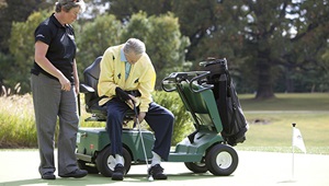 Man putts during the UM Rehab adapted golf program