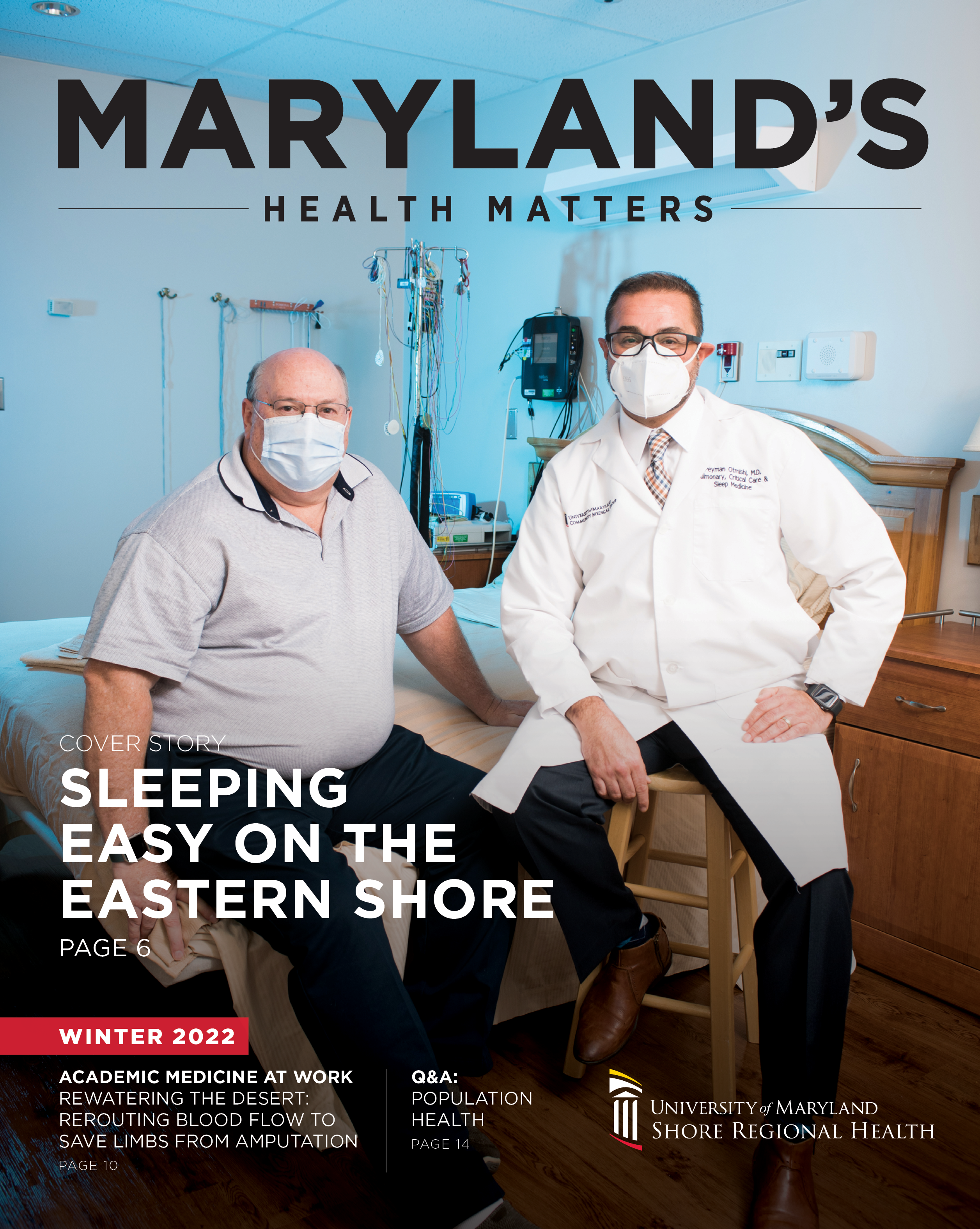 A doctor and his patient sit side by side in a Sleep Study Room, which has a blue background. They are wearing masks.