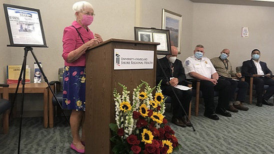 Maryland State Senator Addie Eckardt is shown speaking at the event honoring Gary Jones. To her right are Ken Kozel, President and CEO, UM Shore Regional Health; Brian LeCates, Director, Talbot County Department of Emergency Services; Steve Eisemann, Director, Respiratory Services, UM SRH; and Dr. Benjamin Remo, Medical Director, Electrophysiology, UM SRH.