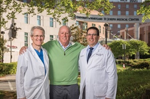Jim Slevin with cardiologist, Steven Pollock, MD and Stewart Finney, chief of cardiac surgery