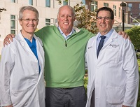 Jim Slevin with cardiologist, Steven Pollock, MD and Stewart Finney, chief of cardiac surgery thumbnail