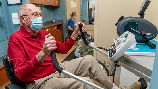 Man exercising on a Cardiac Rehabilitation machine