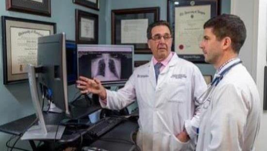 Two doctors discussing x-rays