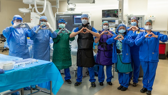 Medical staff making the heart sign with their hands