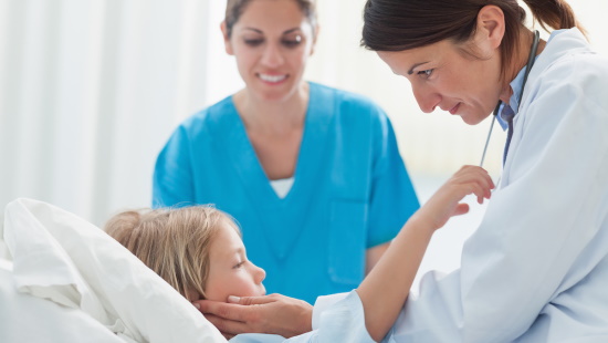 Doctor and nurse caring for pediatric patient