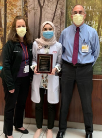 Rawan Amir, MD receiving Resident Physician of the Year