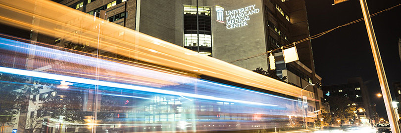A bus driving in front of the University of Maryland Medical Center's entrance
