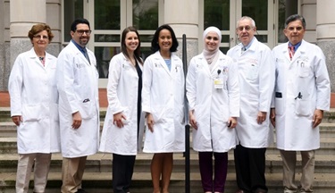 Rheumatology Fellows in front of building