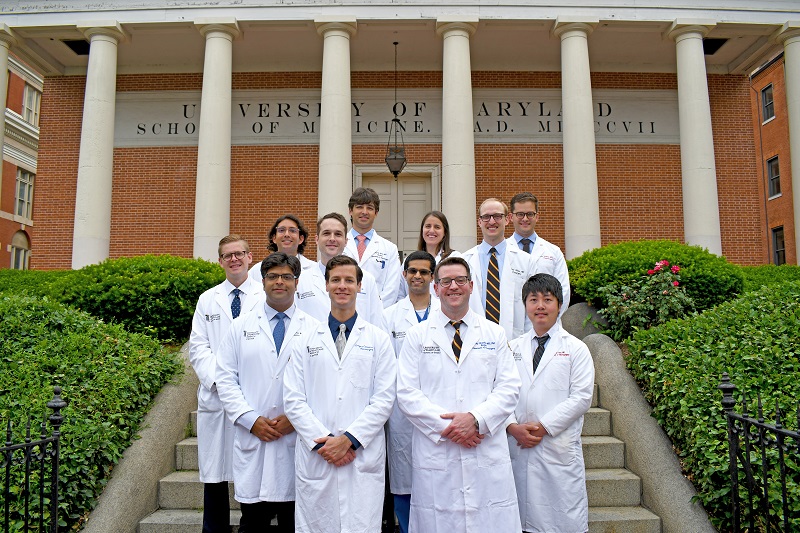 neurosurgery residents group photo in front of school of medicine building