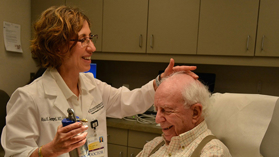 Dr. Jampel working with patient