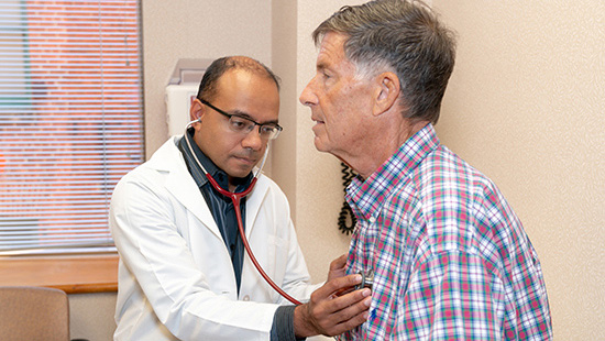 Dr. Gautam Ramani listens to CTEPH patient Benton Berman's heart