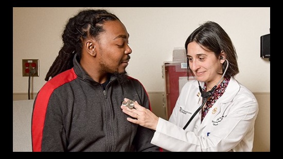 Hematologist Jennie Law interactis with a sickle cell patient