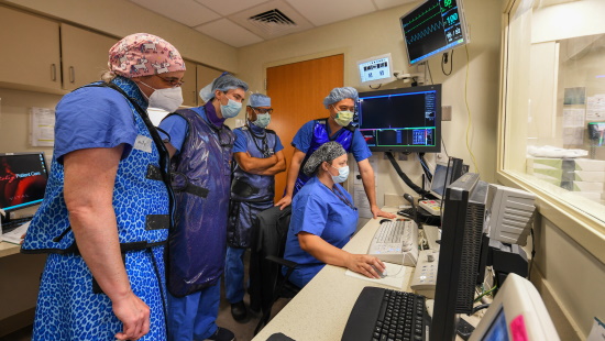 Interventional radiology team members at work