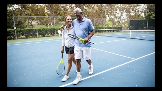 A couple ona tennis court