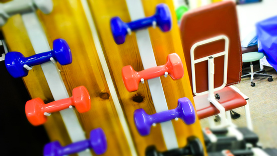 Weights and workout equipment at a physical therapy facility