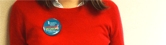 Bridge Program woman wearing a red shirt with a bridge program button