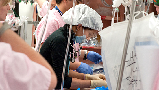 A physician helping during trauma surgery