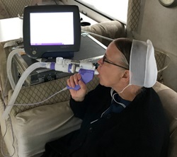 An amish woman uses a pulmonary device