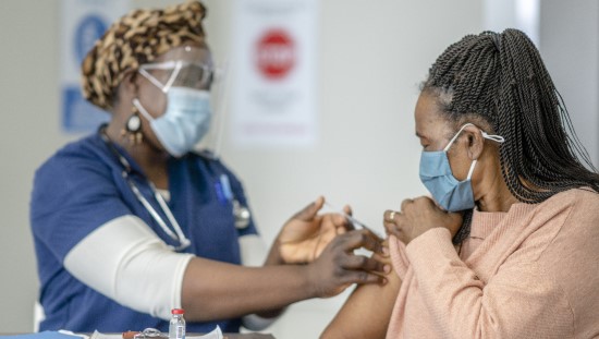 Nurse giving patient a vaccine