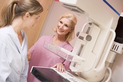 A patient talks with a nurse before receiving a mammorgram