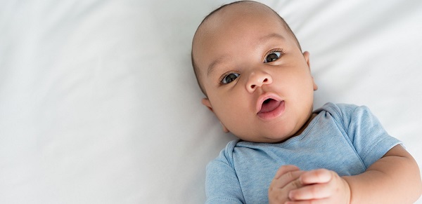 Newborn baby looking at the camera