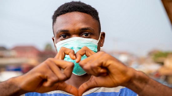 Man making heart shape with hands