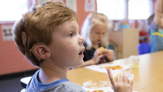Young boy with cochlear implant