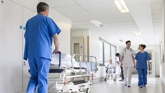 Heart Failure - Patient being pushed down a hospital hallway