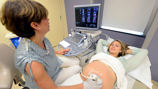 Dr. Turan with a patient